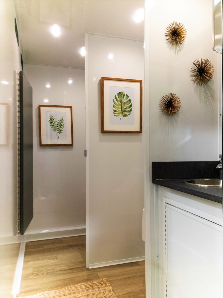 Interior of luxury portable restroom trailer rentals in Texas Houston”  class=