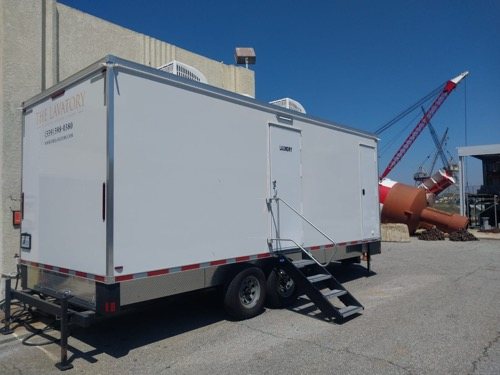 Laundry trailer set up on a San Diego County site, wider view