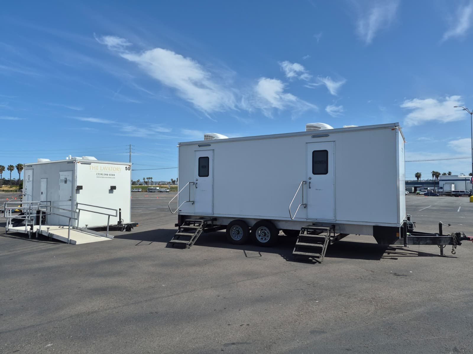 A Lavatory luxury restroom trailer set up for an event in Sparks, Nevada, with flushing china toilets, running water, and climate control inside