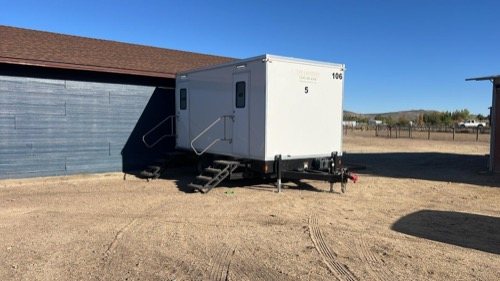 2 station restroom trailer in the desert jobsite, a Sparks restroom trailer rental job