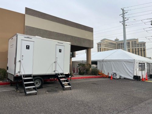 Restroom trailer set on a vineyard event lawn near Lindon