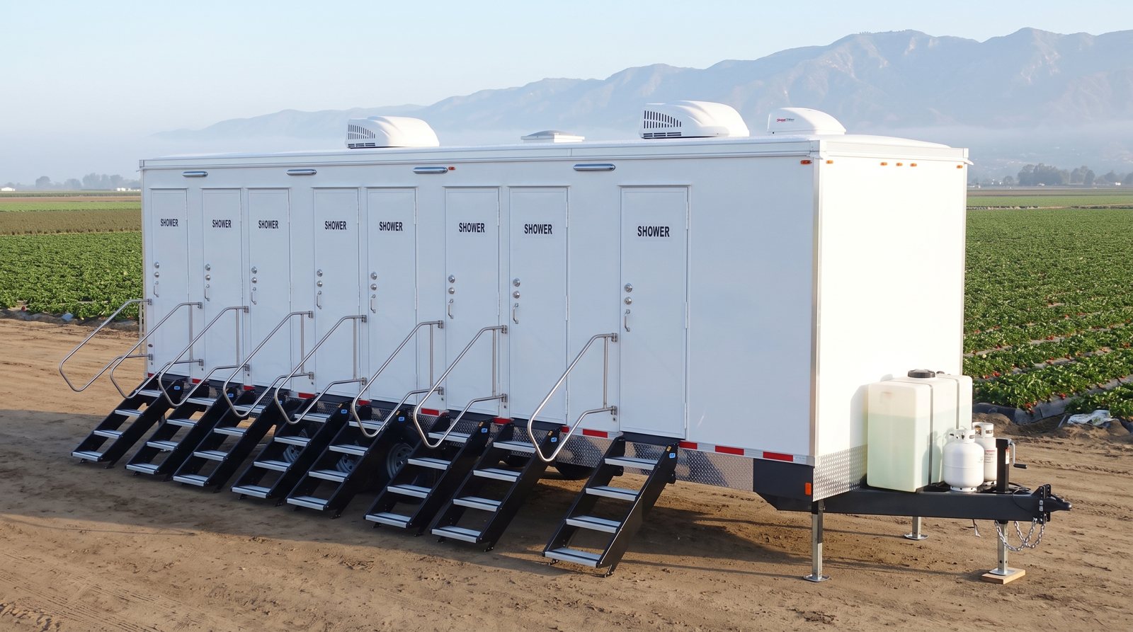 Private 8-station shower trailer rental parked in Oxnard, CA