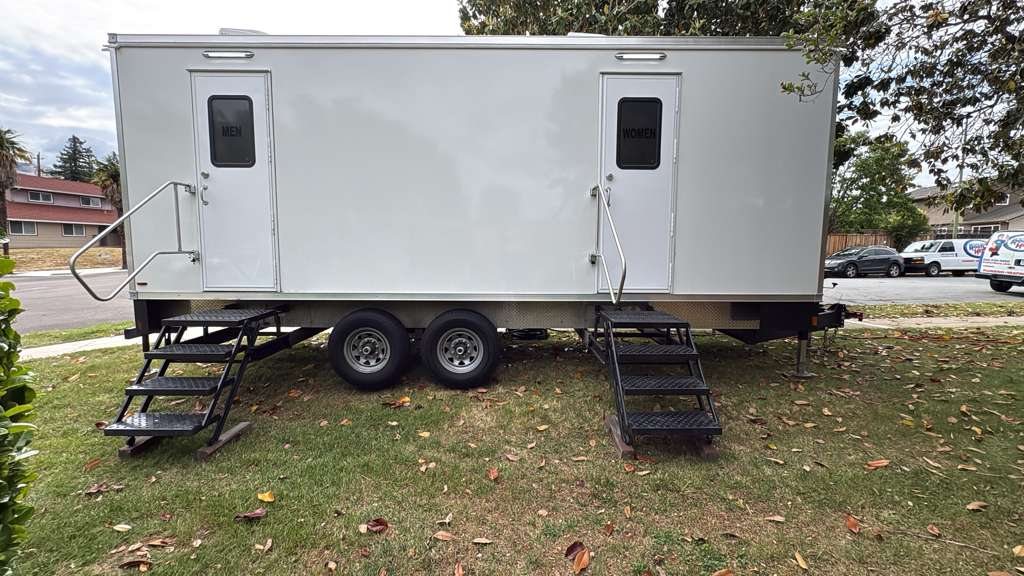 9 station restroom trailer parked at the residential backyard (sleeper bunkhouse trailer rental, the area)